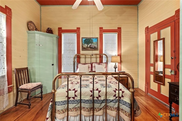 bedroom featuring wood-type flooring and ceiling fan