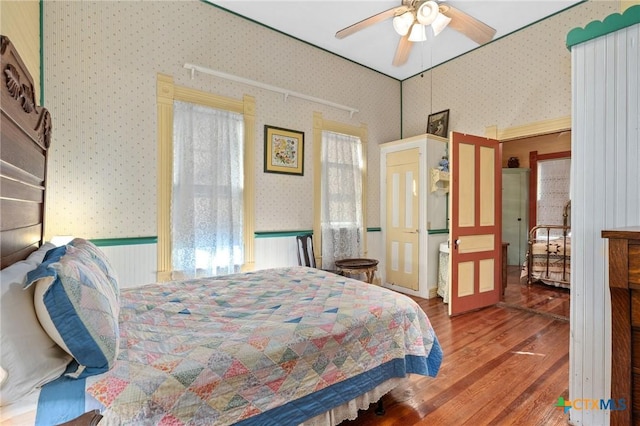 bedroom with wood-type flooring and ceiling fan