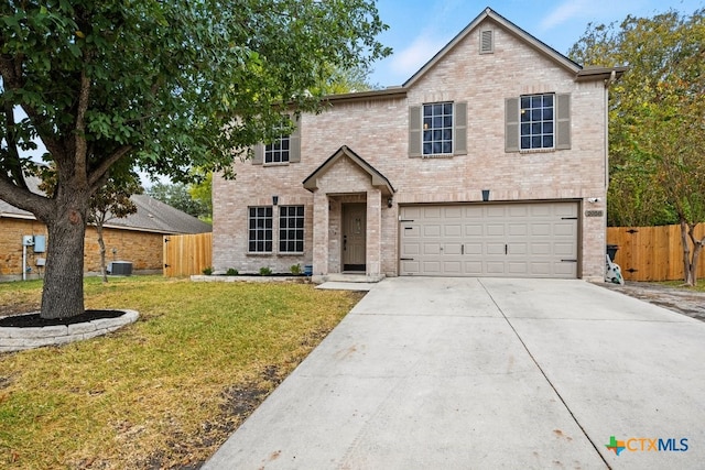 front of property with a garage, central AC, and a front yard