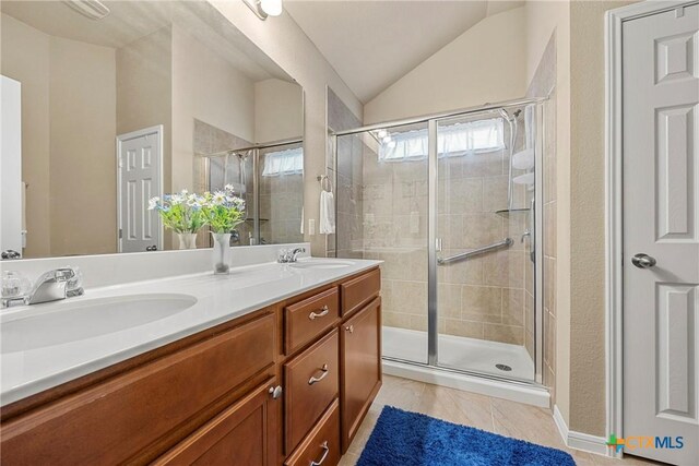 1212 Wethersfield Ln, Temple, TX 76504 - full bath with double vanity, a shower stall, and vaulted ceiling
