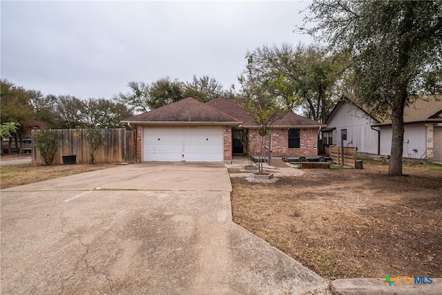 single story home featuring a garage