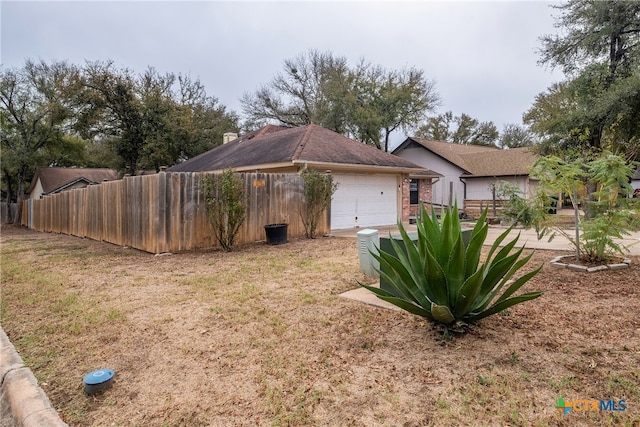 view of side of property with a garage