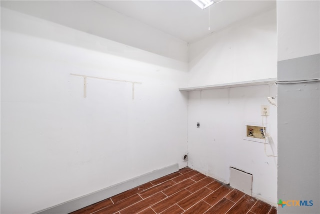 laundry area featuring dark hardwood / wood-style flooring, washer hookup, and hookup for an electric dryer