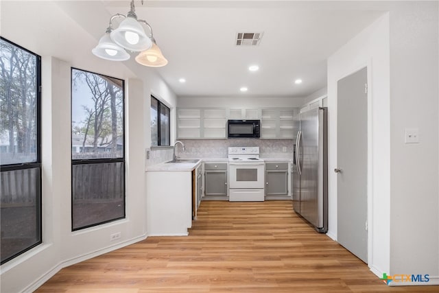 kitchen featuring stainless steel refrigerator with ice dispenser, gray cabinetry, electric range, light hardwood / wood-style flooring, and hanging light fixtures