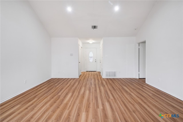 unfurnished room with light wood-type flooring