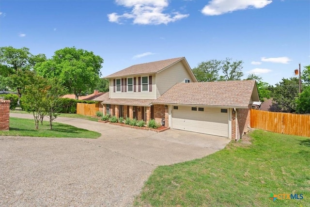 traditional home with driveway, a garage, brick siding, and a shingled roof