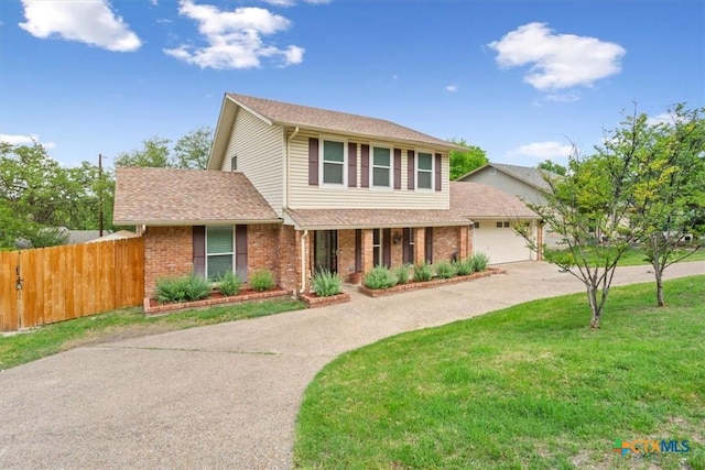 traditional home featuring driveway, brick siding, a porch, and roof with shingles