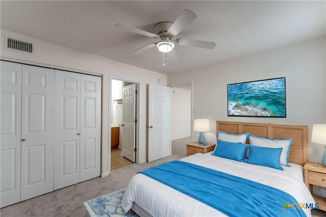 carpeted bedroom featuring a closet and ceiling fan