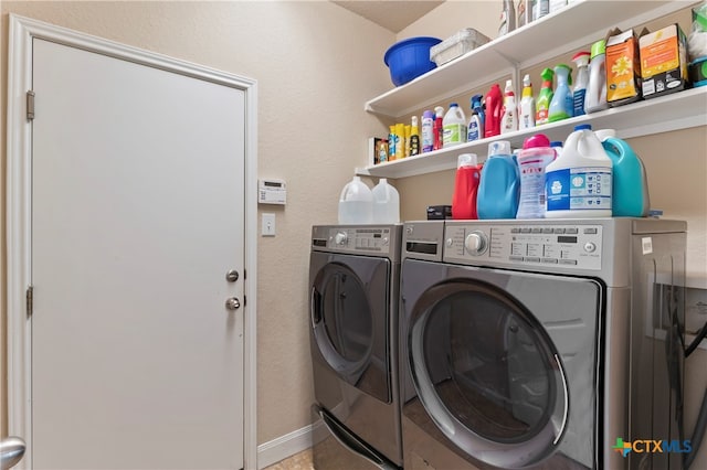 laundry room featuring washing machine and dryer