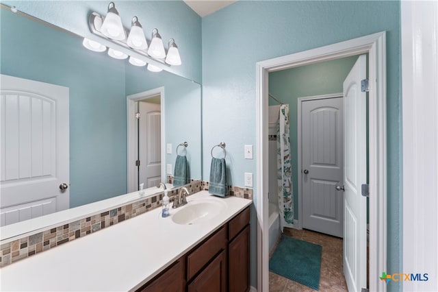 bathroom with tile patterned floors, vanity, and shower / bathtub combination with curtain