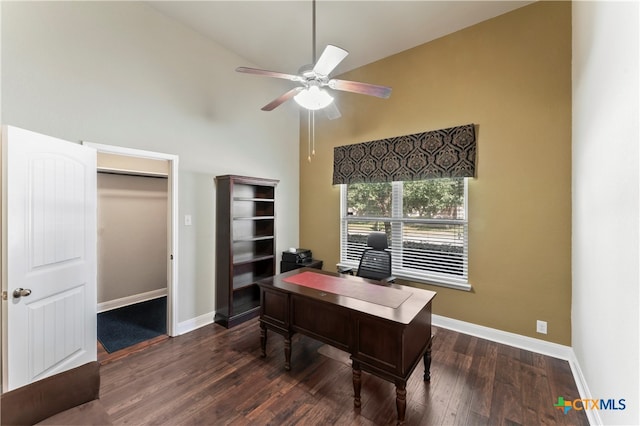 office area featuring dark wood-type flooring, ceiling fan, and high vaulted ceiling