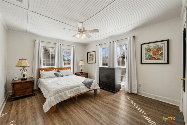 bedroom with multiple windows, dark hardwood / wood-style flooring, ceiling fan, and crown molding