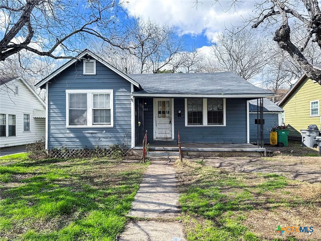 bungalow with a garage and a porch