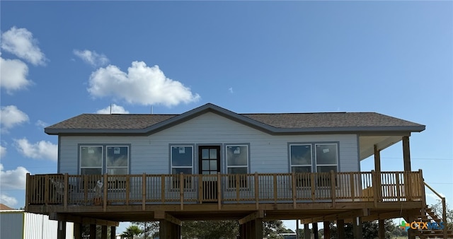 back of house featuring a deck