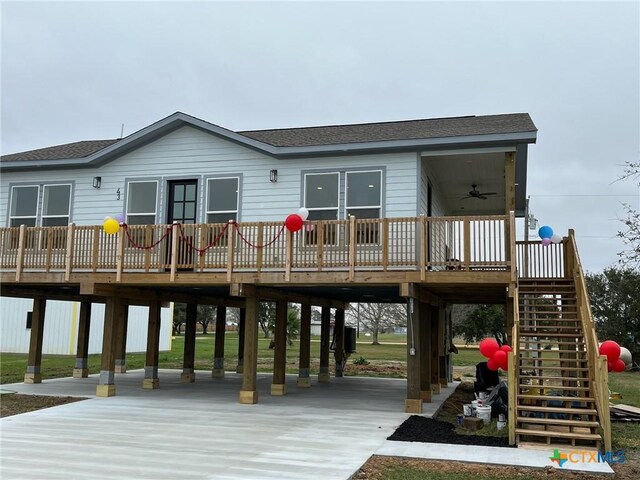 back of property with a wooden deck