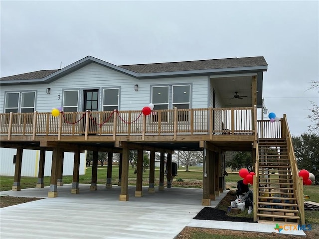 exterior space with ceiling fan