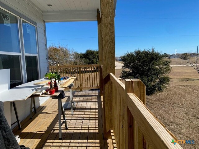 wooden deck with ceiling fan