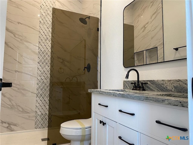 43 Buckskin Dr, Palacios, TX 77465 - bathroom featuring toilet, vanity, and a shower stall