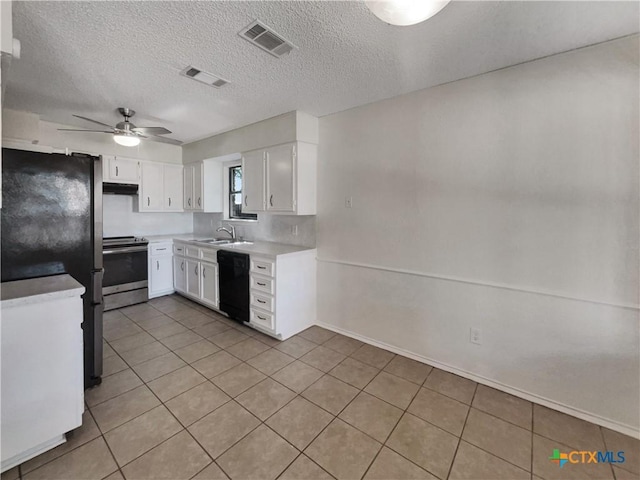 1009 N 4th St, Copperas Cove, TX 76522 - kitchen with stainless steel electric stove, black dishwasher, a sink, under cabinet range hood, and white cabinetry