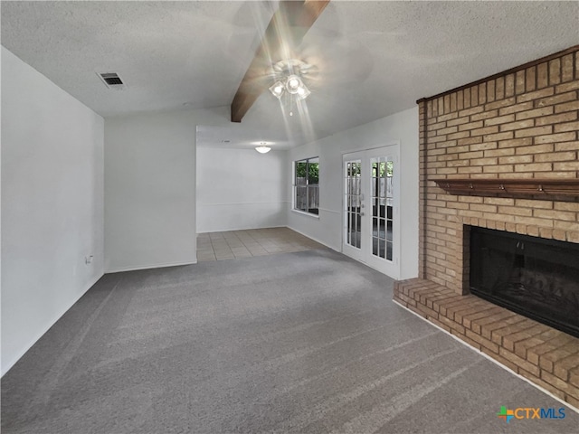 unfurnished living room featuring a textured ceiling, ceiling fan, and carpet floors