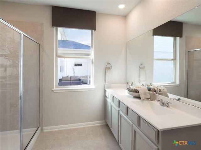 bathroom featuring tile patterned flooring, vanity, and an enclosed shower