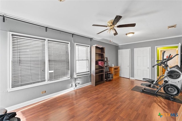 604 Westwood Dr, San Antonio, TX 78212 - exercise area featuring ceiling fan, wood finished floors, baseboards, and crown molding