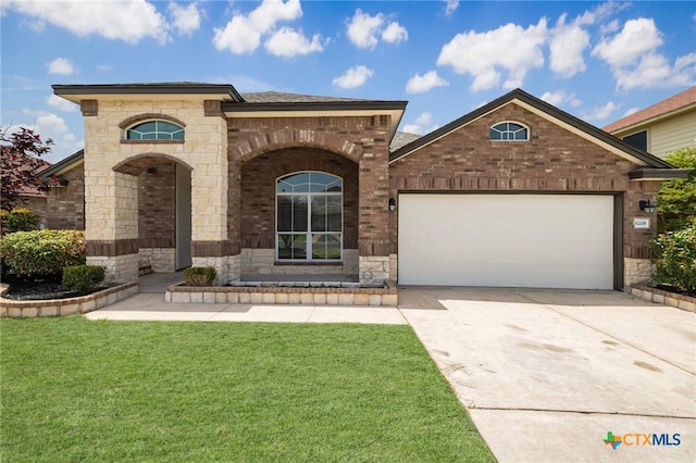 6208 Suellen Ln, Killeen, TX 76542 - view of front of property featuring stone siding, concrete driveway, a garage, a front yard, and brick siding
