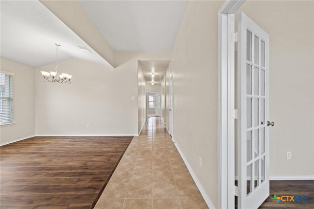 6208 Suellen Ln, Killeen, TX 76542 - corridor featuring healthy amount of natural light, a chandelier, and tile patterned flooring