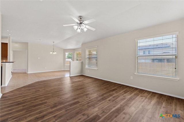6208 Suellen Ln, Killeen, TX 76542 - unfurnished living room featuring a chandelier, light wood-style flooring, a ceiling fan, and lofted ceiling