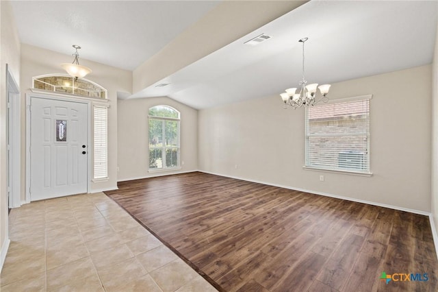 6208 Suellen Ln, Killeen, TX 76542 - entryway featuring a chandelier, lofted ceiling, and light wood-type flooring