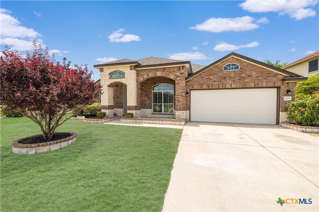 6208 Suellen Ln, Killeen, TX 76542 - view of front of house featuring an attached garage, brick siding, driveway, a front lawn, and stone siding