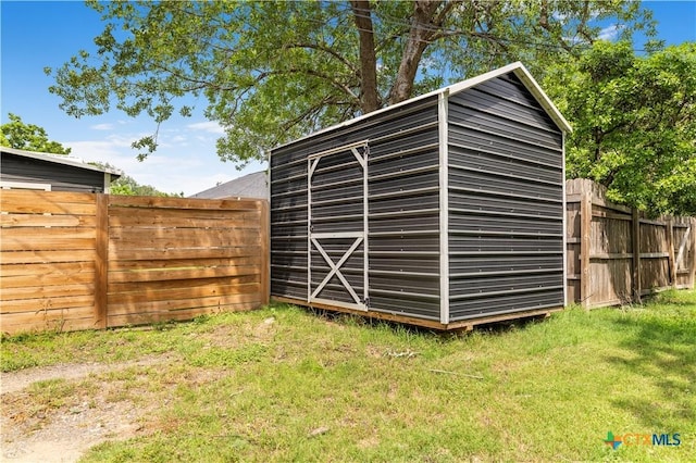view of shed featuring a fenced backyard