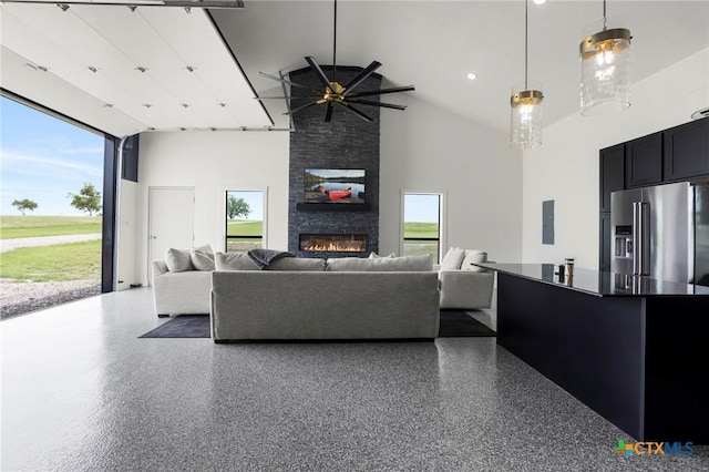 295 Honey Bee Ln, Rogers, TX 76569 - living room featuring ceiling fan, a wealth of natural light, high vaulted ceiling, and a fireplace