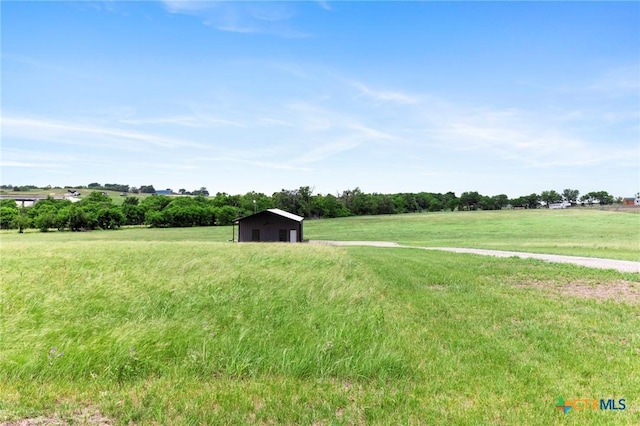 295 Honey Bee Ln, Rogers, TX 76569 - view of yard featuring an outdoor structure and a rural view