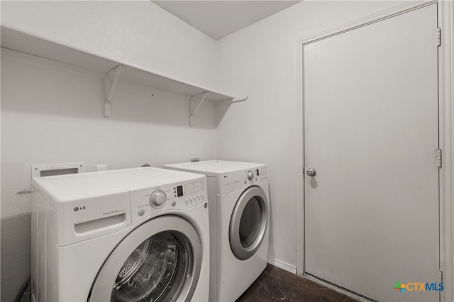 laundry room with independent washer and dryer