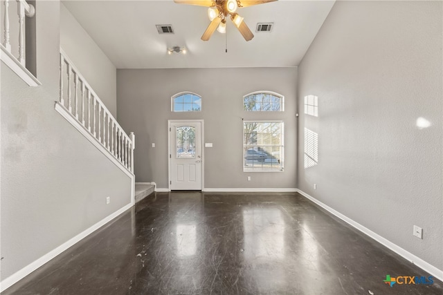 foyer with dark hardwood / wood-style flooring and ceiling fan