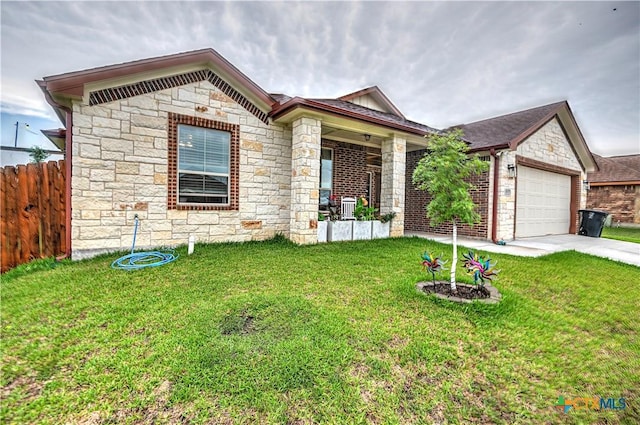 view of front of house with a garage and a front yard