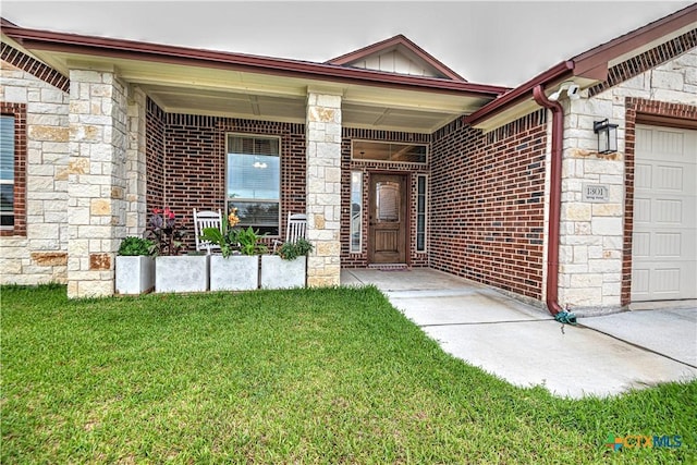 doorway to property featuring a lawn