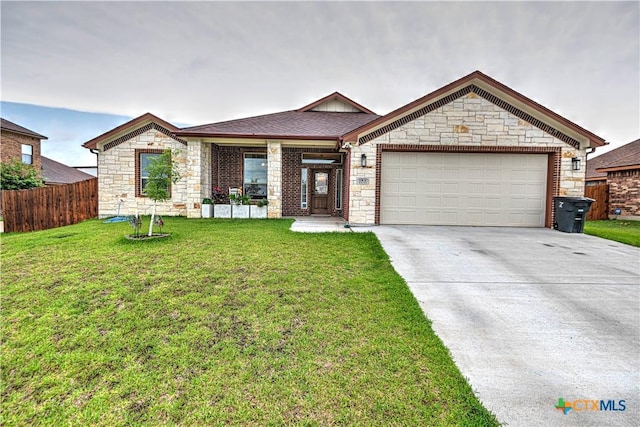 view of front of house with a garage and a front yard