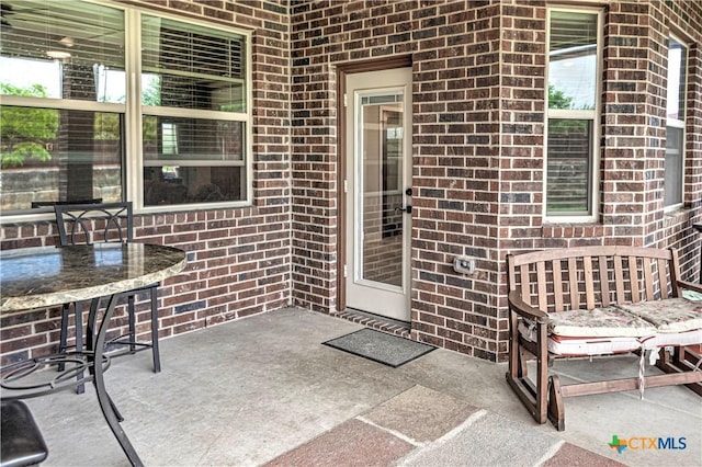 doorway to property featuring a patio area