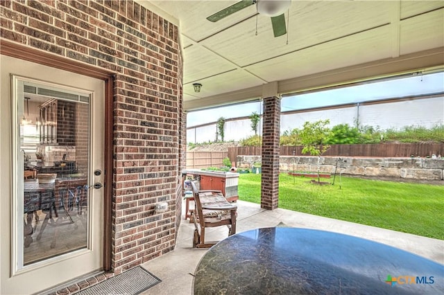 view of patio / terrace with a jacuzzi and ceiling fan