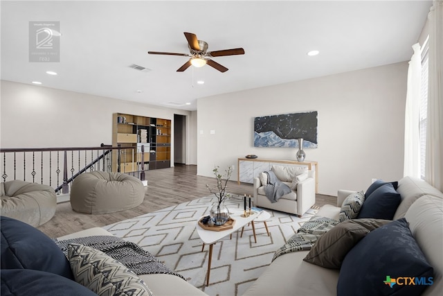 210 Mancos Dr, Georgetown, TX 78626 - living area with ceiling fan, wood finished floors, and recessed lighting