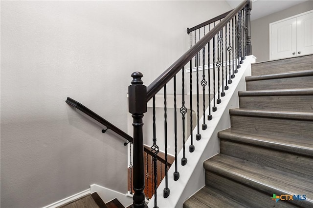 210 Mancos Dr, Georgetown, TX 78626 - stairs with baseboards and wood finished floors