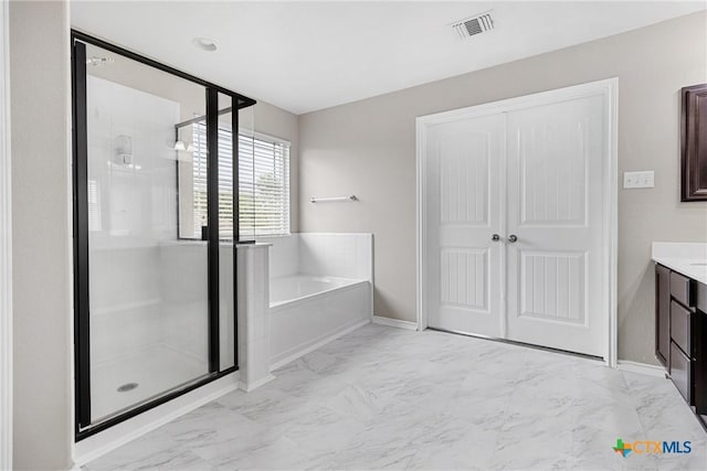 210 Mancos Dr, Georgetown, TX 78626 - full bath featuring a bath, a stall shower, vanity, and marble finish floors