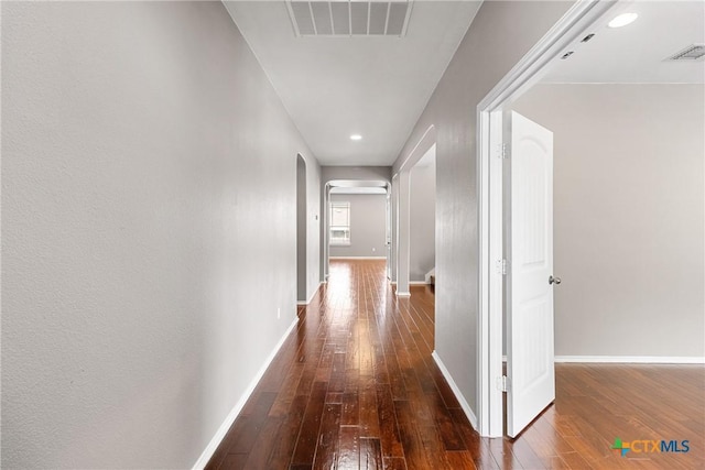 210 Mancos Dr, Georgetown, TX 78626 - corridor featuring arched walkways, dark wood-style flooring, and recessed lighting