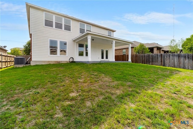 210 Mancos Dr, Georgetown, TX 78626 - rear view of house with a fenced backyard and french doors