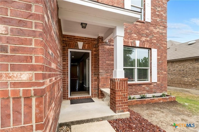 210 Mancos Dr, Georgetown, TX 78626 - view of exterior entry featuring brick siding