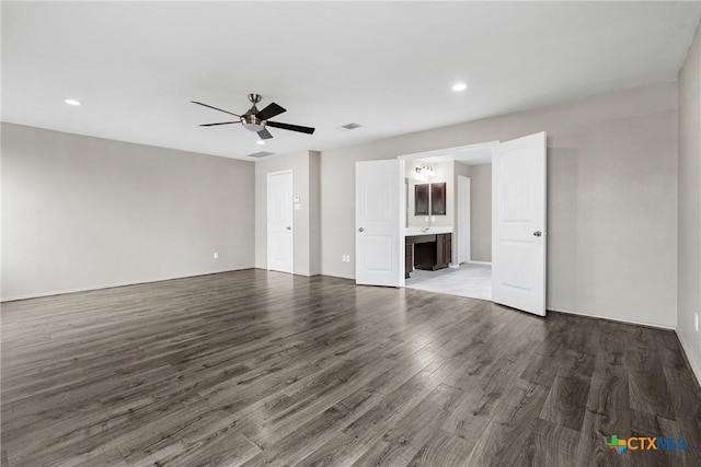 210 Mancos Dr, Georgetown, TX 78626 - unfurnished living room featuring wood finished floors, a ceiling fan, and recessed lighting