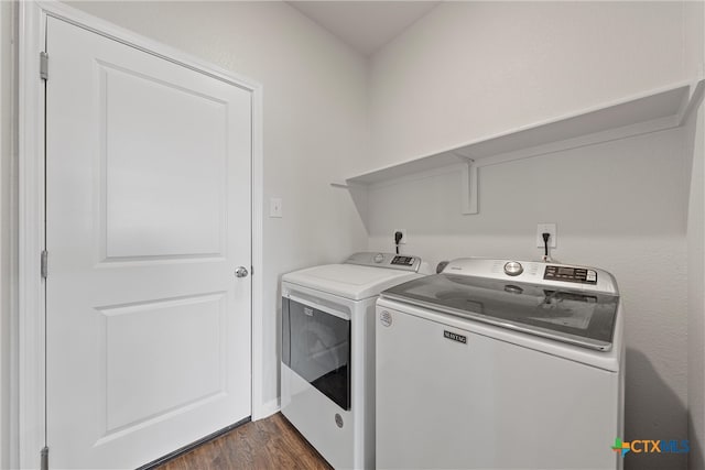 laundry area featuring separate washer and dryer and dark hardwood / wood-style floors