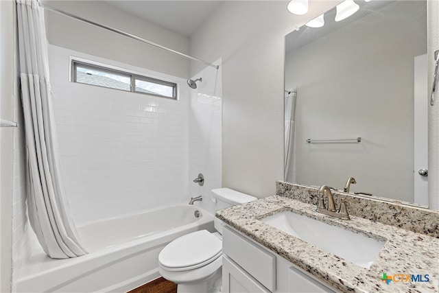 full bathroom with vanity, toilet, and shower / bath combination with curtain